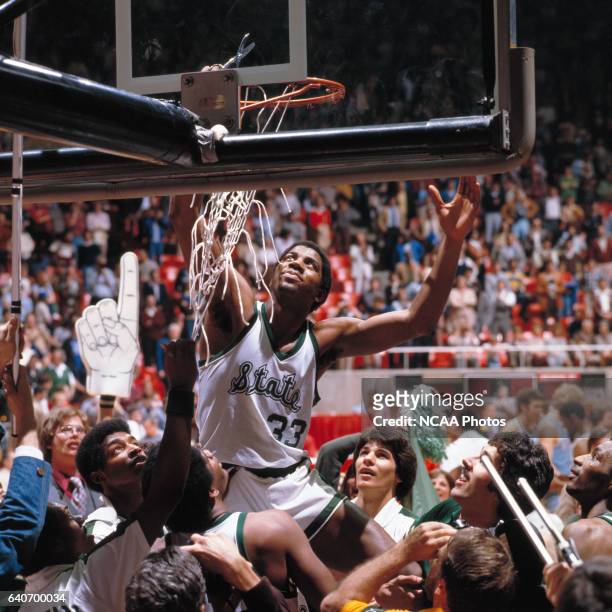 Michigan State guard Earvin "Magic" Johnson cuts down the net after winning the NCAA Photos via Getty Images Men's National Basketball Final Four...
