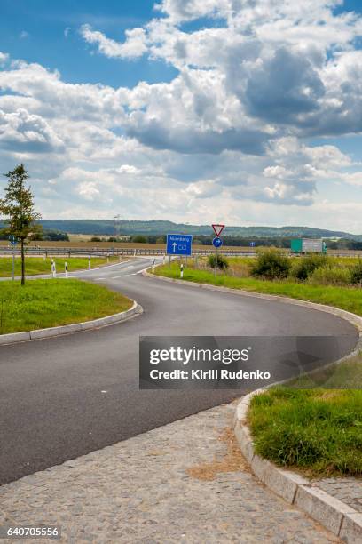 acceleration lane from a rest station to the autobahn in bavaria, germany - highway exit sign stock pictures, royalty-free photos & images