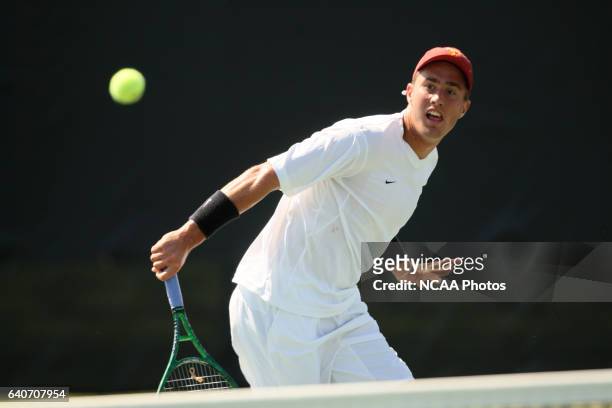 Steve Johnson of the University of Southern California hits a backhand in his singles match against Brian Koniecko of Ohio State University during...