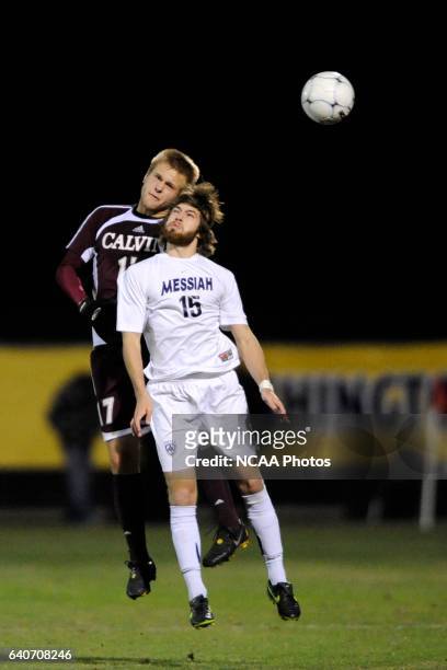 Danny Thompson of Messiah College battles for a header with Kyle Billen of Calvin College during the Division III Men's Soccer Championship held at...