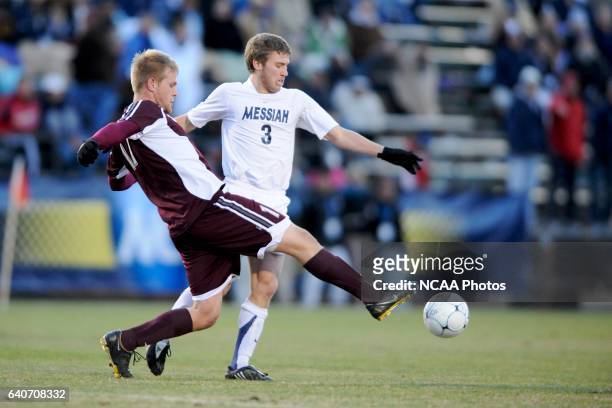 Geoff Pezon of Messiah College is challenged by Kyle Billen of Calvin College during the Division III Men's Soccer Championship held at Blossom...