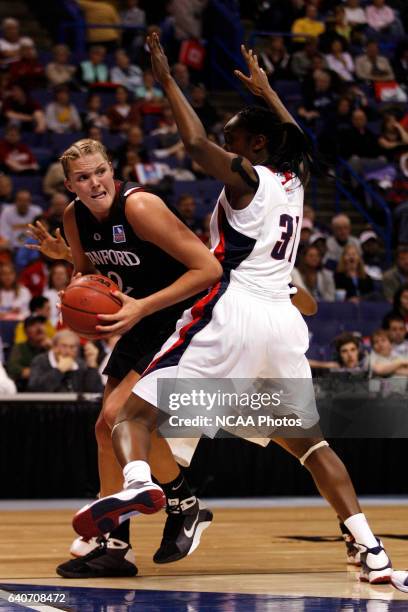 Tina Charles of the University of Connecticut defends against Jayne Appel of Stanford University during the Division I Women's Basketball Semifinals...