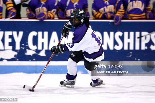 Tarasai Karega of Amherst College carries the puck up the ice during the 2009 NCAA Photos via Getty Images Division III Women's Ice Hockey...