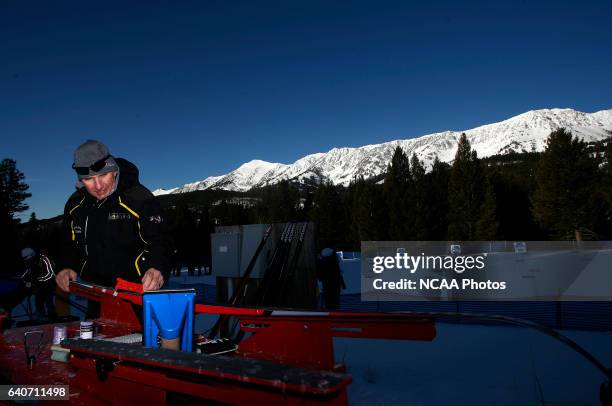 Bud Fisher, head coach for Williams College, waxes skis for his racers in the Women's 15k classic as part of the Men's and Women's Skiing...