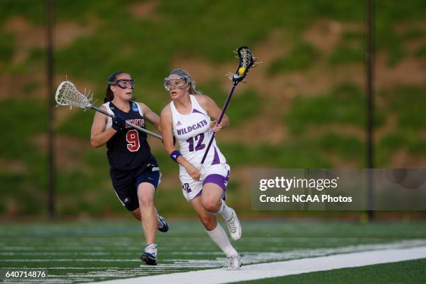 Christy Finch of Northwestern University is chased by Courtney Lubbe of the University of Pennsylvania during the Division I Women's Lacrosse...