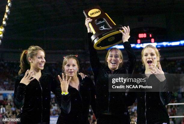 From left, University of Georgia seniors Nikki Childs, Audrey Bowers, Megan Dowlan, Katie Heenan celebrate winning the Division I Women?s Gymnastics...