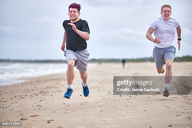 two brothers racing on the beach - championship day two stock pictures, royalty-free photos & images