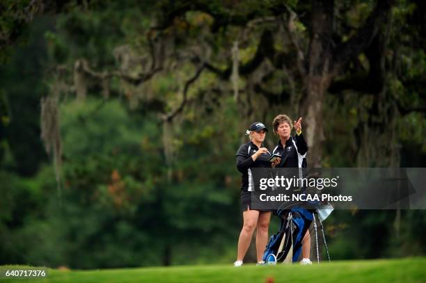 Catlin Bennett of Grand Valley State consults with head coach Lori Stinson during the Division II Women's Golf Championship held at Memorial Park in...