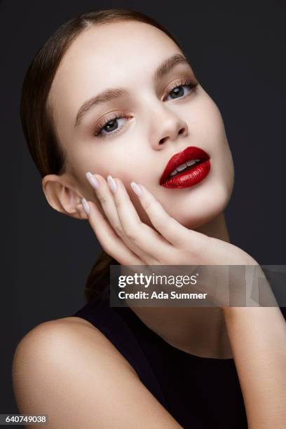 close up of glamorous woman touching her face - hand on chin stock pictures, royalty-free photos & images