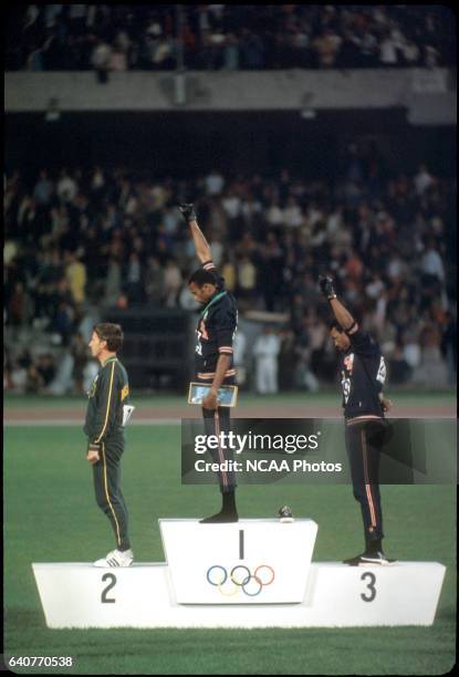 Tommy Smith and John Carlos of the US raise their fists in the "Black Power Salute" during the playing of the national anthem at the Olympics in...