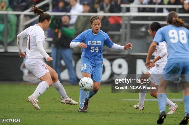 Casey Nogueira of the University of North Carolina splits Hillary Heath and Rachel Quon of Stanford University during the Division I Women's Soccer...