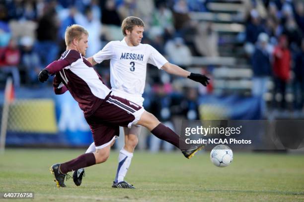 Geoff Pezon of Messiah College is challenged by Kyle Billen of Calvin College during the Division III Men's Soccer Championship held at Blossom...
