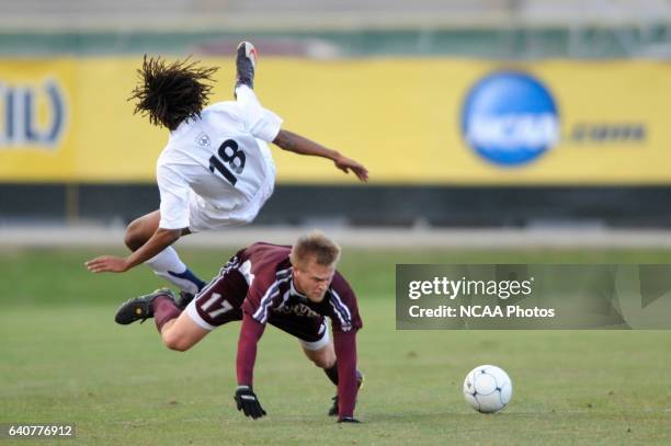 Jevon Gondwe of Messiah College collides with Kyle Billen of Calvin College during the Division III Men's Soccer Championship held at Blossom Soccer...
