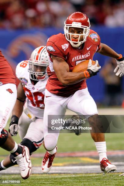 Running back Knile Davis of the University of Arkansas looks for an opening against Ohio State University during the Allstate Sugar Bowl held at the...