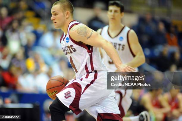 Jeremy Kendle of Bellarmine University pushes the ball up court against BYU-Hawaii during the Division II Men's Basketball Championship held at the...