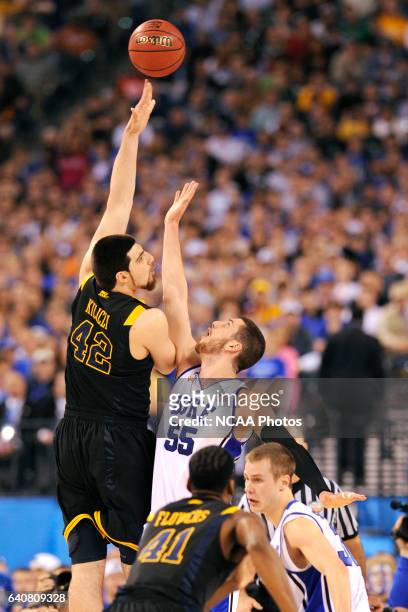 Deniz Kilicli of West Virginia puts up a shot in front of Brian Zoubek of Duke during the semi final game between Duke and West Virginia at the Men's...