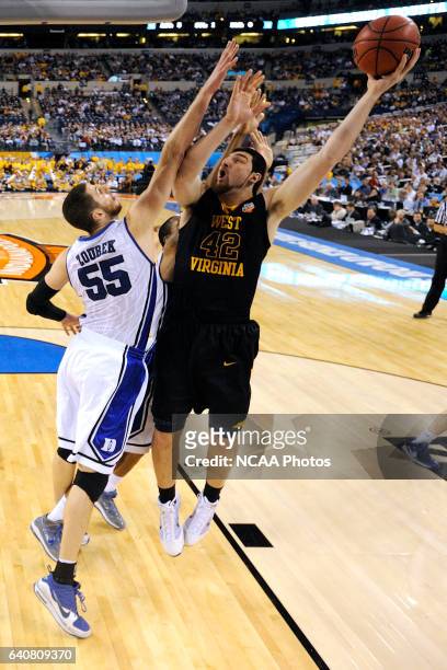 Deniz Kilicli from West Virginia attempts a shot over Brian Zoubek from Duke during the semi final game of the Men's Final Four Basketball...