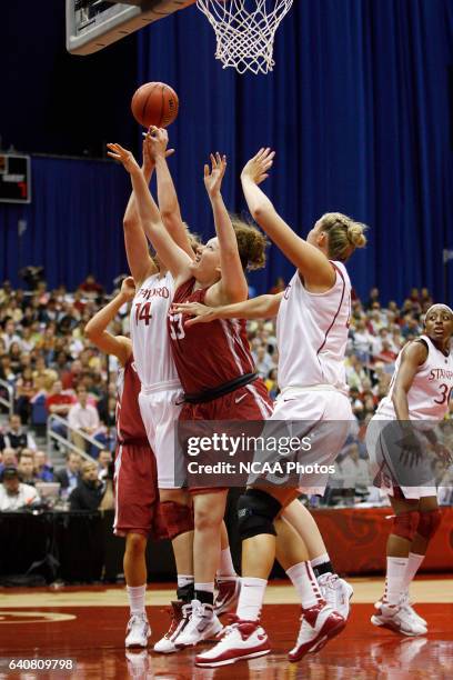 Joanna McFarland of the University of Oklahoma battles Kayla Pedersen and Jayne Appel of Stanford University for a rebound during the Division I...