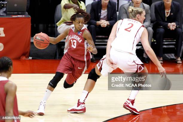 University of Oklahoma guard Danielle Robinson dribbles around Stanford University center Jayne Appel during the Division I Women's Basketball...