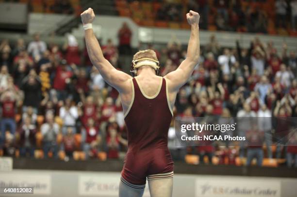 Clayton Rush of Coe College celebrates after winning his match against Tyler Erdman of Elizabethtown in their 125 pound match during the Division III...