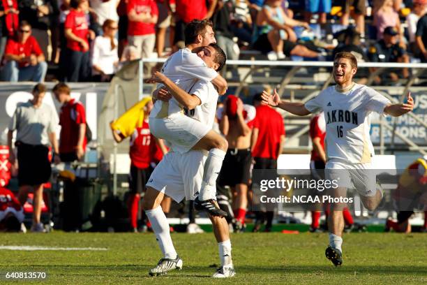 Zarek Valentin and Chad Barson of the University of Akron celebrate after defeating the University of Louisville during the Division I Men's Soccer...