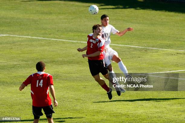 Zarek Valentin of the University of Akron and Charlie Campbell of the University of Louisville battle for a header during the Division I Men's Soccer...