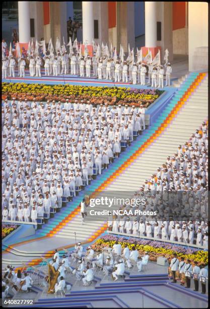 Gold medal decathlete Rafer Johnson running up the stairs towards the Olympic flame which he is about to light during the opening ceremony during the...