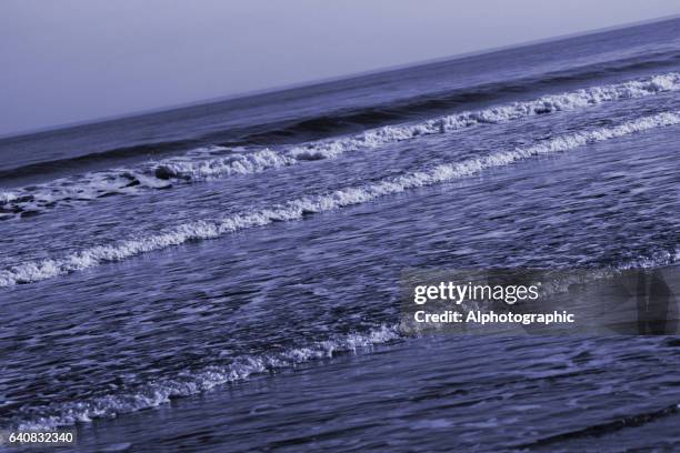 toned wave forms on north east beach - st marys island stock pictures, royalty-free photos & images