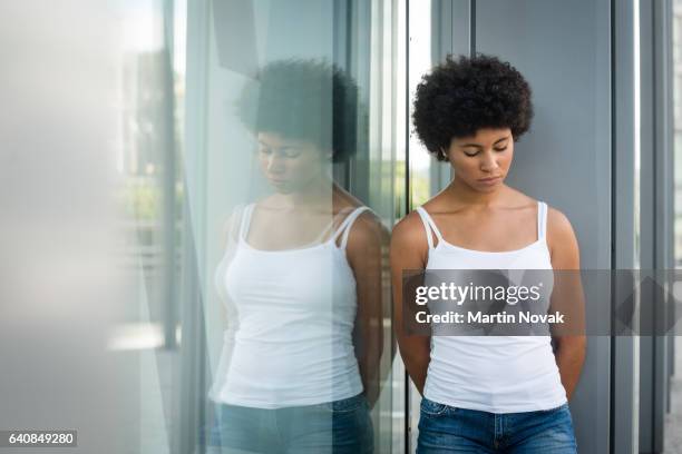 embarrassed teen girl facing down - woman smiling facing down stock pictures, royalty-free photos & images