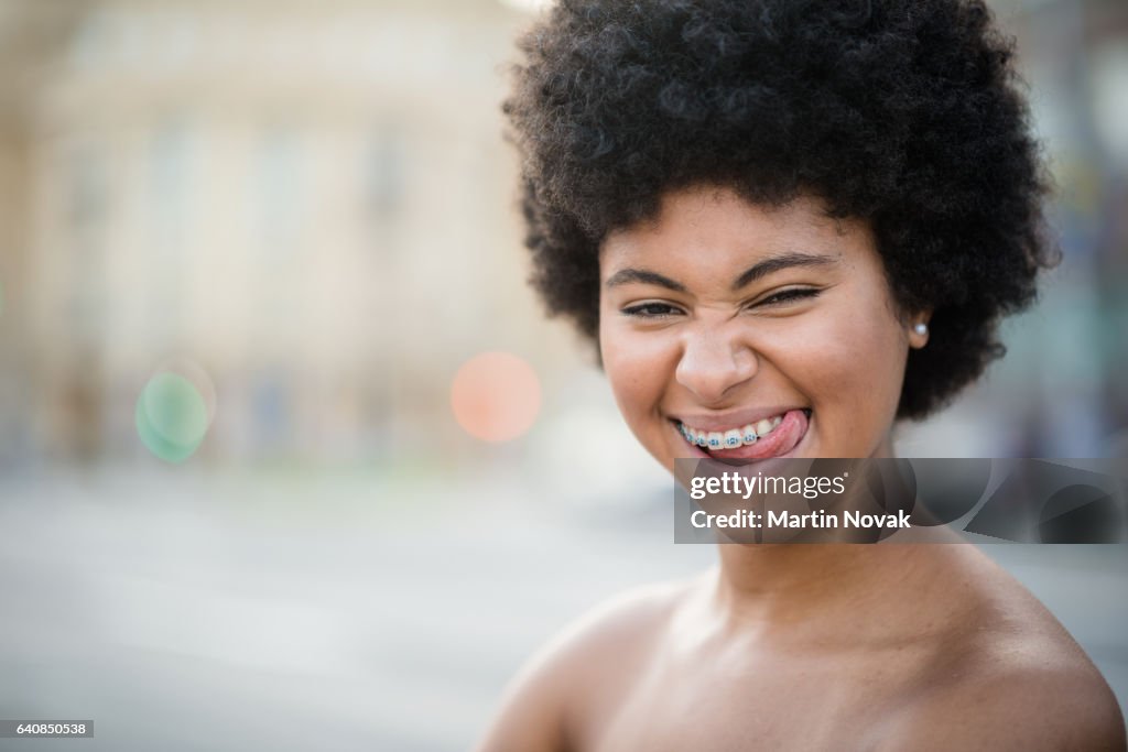 Cheeky teenager sticking her tongue out