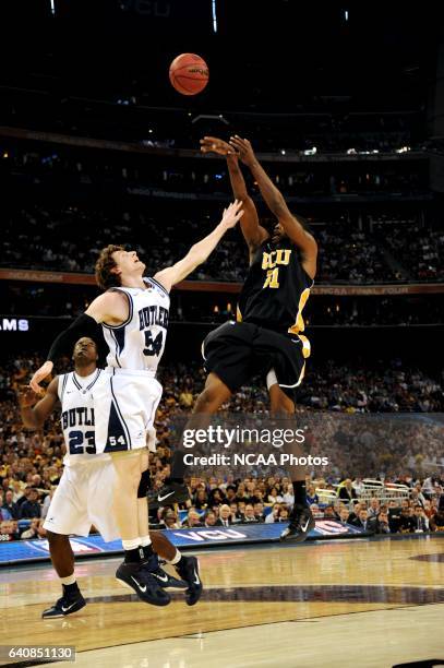 Jamie Skeen of Virginia Commonwealth University shoots over Matt Howard of Butler University during the semifinal game of the 2011 NCAA Photos via...