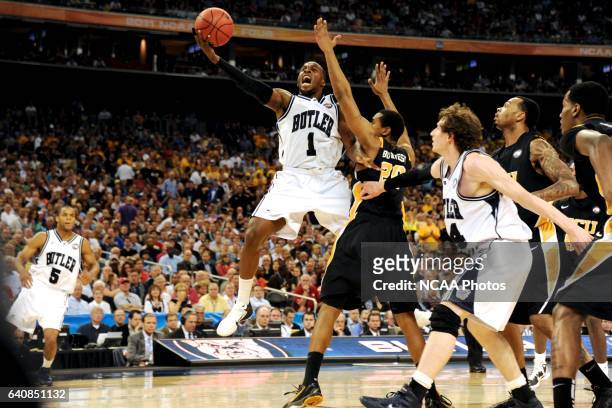 Shelvin Mack of Butler University goes for a layup against Bradford Burgess of Virginia Commonwealth University during the semifinal game of the 2011...