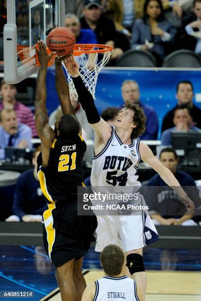 Matt Howard of Butler University tries to block a shot by Jamie Skeen of Virginia Commonwealth University during the semifinal game of the 2011 NCAA...