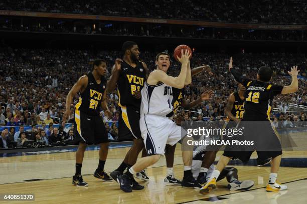 Andrew Smith of Butler University works his way to the hoop past Jamie Skeen of Virginia Commonwealth University during the 2011 NCAA Photos via...