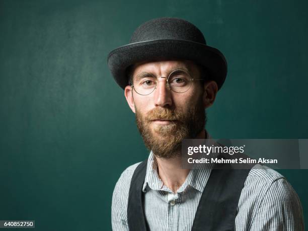 portrait of adult man with bowler hat - bowler hats stock pictures, royalty-free photos & images