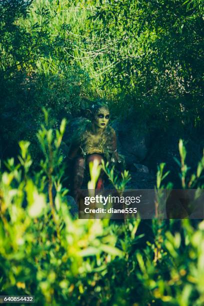 pretty water nymph fantasy creature near a creek - forest nymph stock pictures, royalty-free photos & images