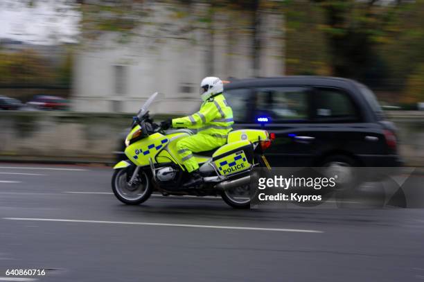 uk, great britain, england, london, view of policeman riding police motorcycle - london police ストックフォトと画像