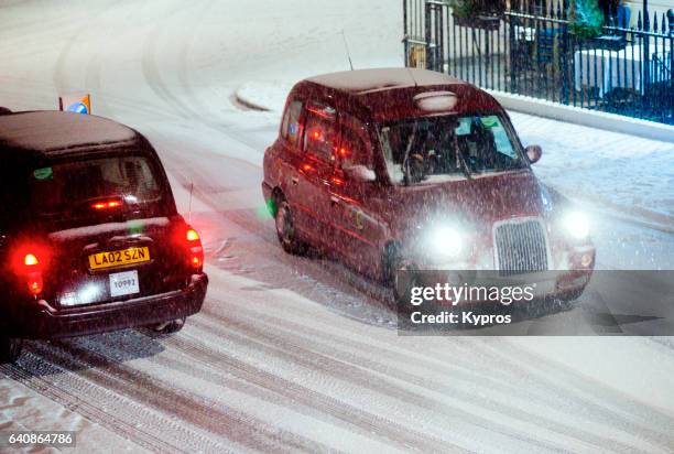 uk, great britain, england, london, paddington, view of taxi's driving in snow - london taxi ストックフォトと画像