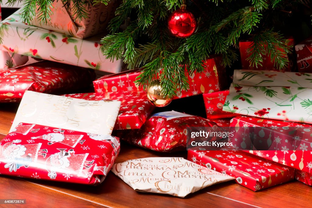 UK, Great Britain, England, London, View Of Wrapped Presents Underneath Christmas Tree