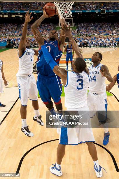 Forward Thomas Robinson from the University of Kansas puts up a shot attempt in front of guard Darius Miller , forward Michael Kidd-Gilchrist and...