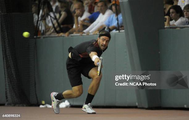 Steve Johnson of the University of Southern California returns an overhead against the University of Virginia during the Division I Men?s Tennis...