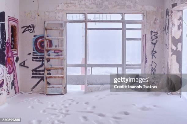 interior of abandoned house covered with snow - abandoned stock pictures, royalty-free photos & images