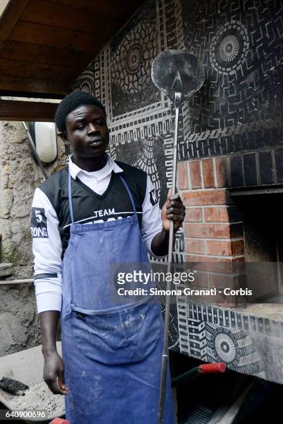 Young refugee cook at the presentation of "Meal Suspended" at Casetta Rossa in Garbatella,on February 2, 2017 in Rome, Italy. The initiative promotes...