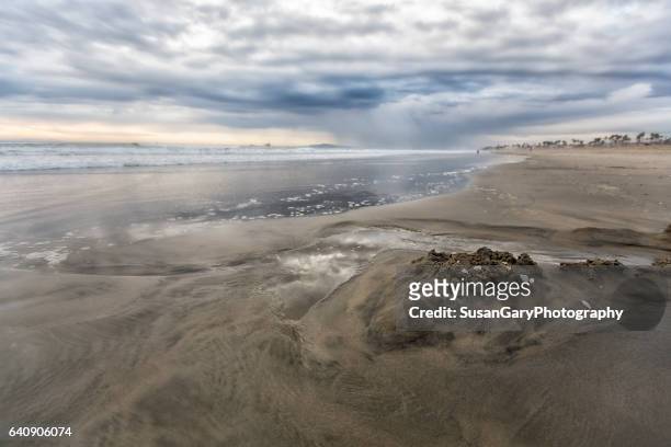 stormy seaside beach - castillo de arena fotografías e imágenes de stock