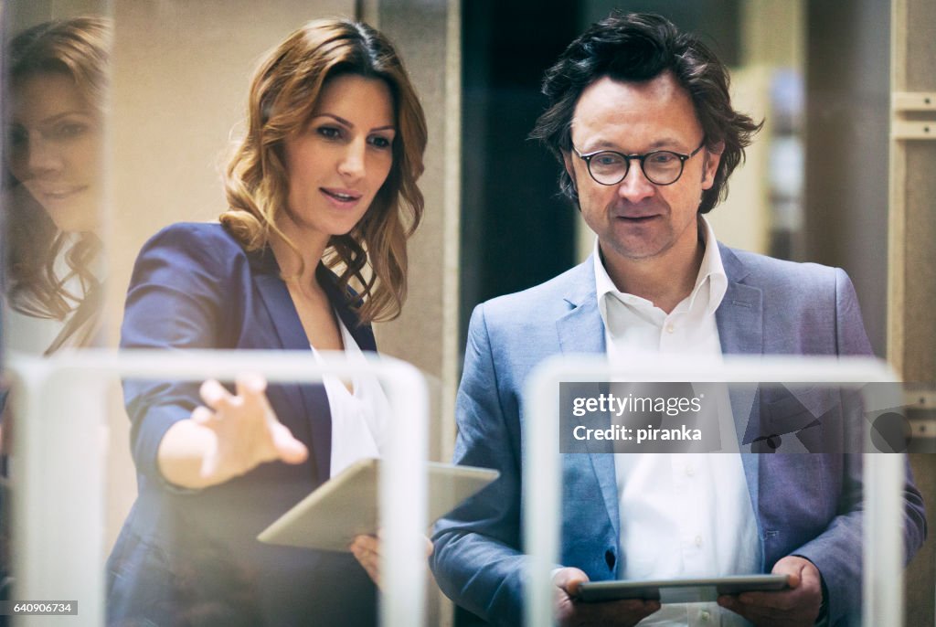 Two business people talking in the in the showroom
