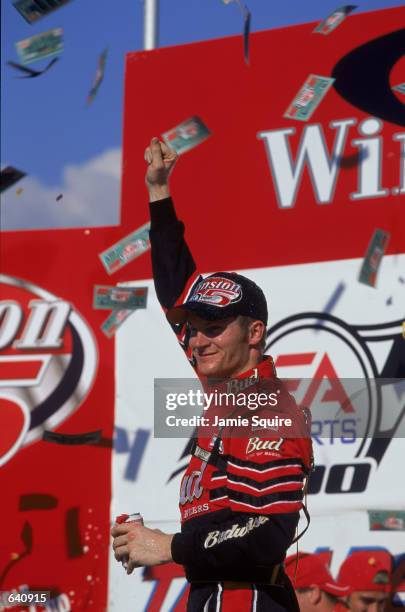 Driver Dale Earnhardt Jr. Celebrates the win after the EA Sports 500 at the Talladega Superspeedway in Talladaga, Alabama.