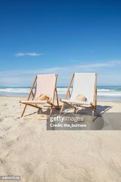 two deck chairs at beach - outdoor chair stock pictures, royalty-free photos & images