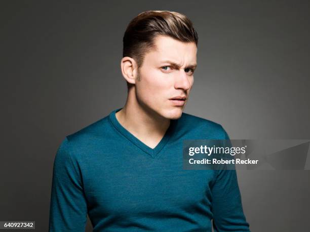 suspicious young man - robert madden stock pictures, royalty-free photos & images