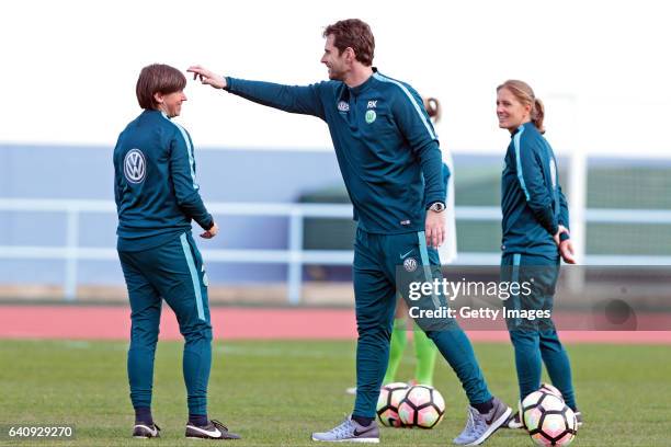 Assistant Coach of Wolfsburg, Ariane Hingst and Britta Carlson with Ralf Kellermann during the warm up training at the Women's Friendly Match between...
