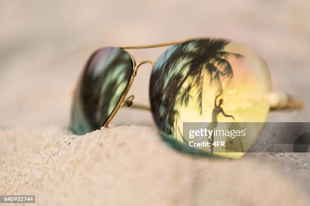 sunset dancing, palm tree sunglasses reflection, thailand - sunglasses reflection stock pictures, royalty-free photos & images